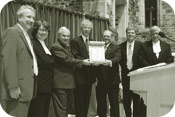 Former Environment Minister Stéphane Dion presents an environmental award to representatives of the Partners for a Green Hill Program