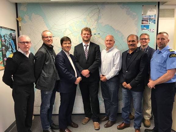 Figure 13 is a photo of members of the Foreign Affairs Committee meeting with Coast Guard representatives and officers at the Marine Communications and Traffic Services Centre in Iqaluit, Nunavut. 