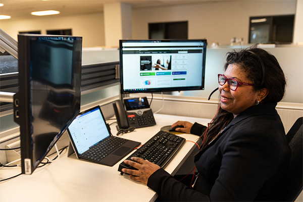 House Administration employee at workstation.